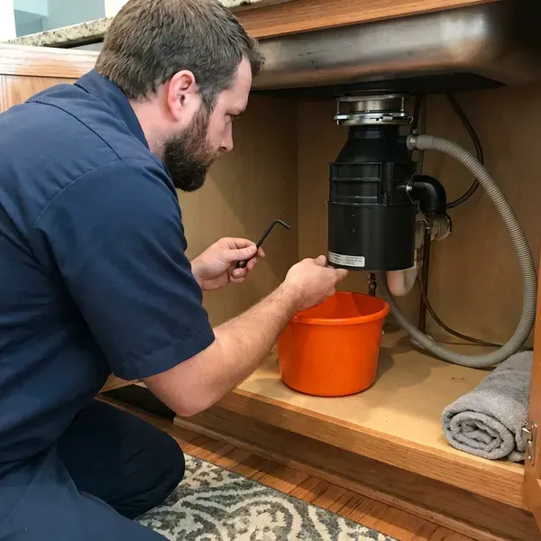 GFR Plumbing technician providing garbage disposal repair in Aurora, CO
